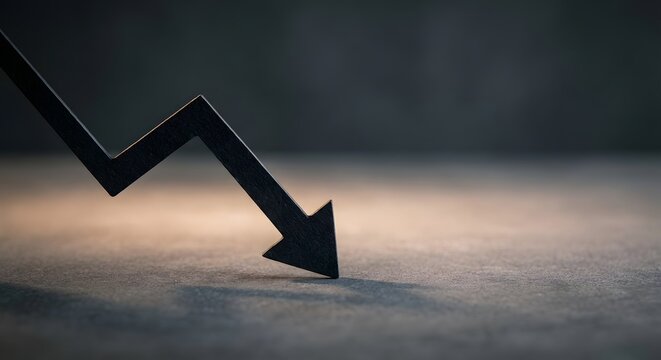 A conceptual image of a black 3D arrow pointing downwards and hitting a textured surface, symbolizing financial loss, economic recession, stock market crash, and business failure.