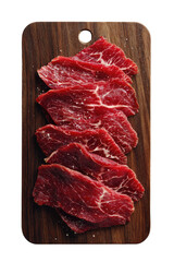 Raw beef slices with salt, arranged on a wooden board. Close-up, overhead view
