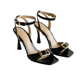 Black patent leather heels with gold buckles, ankle straps, isolated