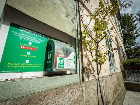 COLLOBRIERES, FRANCE - SEPTEMBER 28, 2025: Public access defibrillator cabinet in a small French village, with Defibrillateur instructions, AED signage highlighting cardiac arrest response in France.