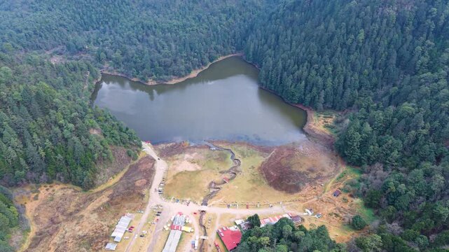 Scenic drone panorama of pine forests and lakes at Lagunas de Zempoala, Mexico