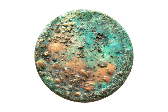 Corroded copper coin with green patina, isolated on transparent background