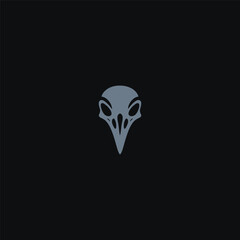 Obraz premium Raven skull logo in dark and striking minimalist design.