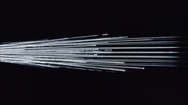 Bright Light Beams Diverge and Expand Against Dark Background