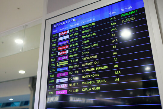 Penang, Malaysia &ndash; Jan 6, 2026: A digital airport departure board showing scheduled international flights, destinations, airlines, gate numbers and departure times inside Penang International Airport.