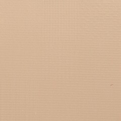 Fototapeta premium a slightly worn brown cardboard box on a table, with crumpled white packing paper resting loosely on top