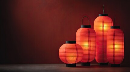 Decorative Asian Lanterns Illuminating Softly Against a Rich Red Wall Designed for Ambience and Warmth in Interior Spaces