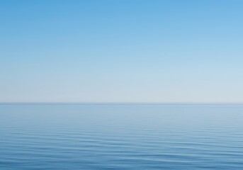 Obraz premium A gentle, fluid horizon line separates soft blue sky and calm water, creating a vast, blank expanse of negative space, backdrop, wallpaper, abstract