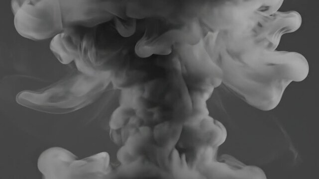 Abstract image of rising smoke or vapor with soft, swirling shapes against a gray background