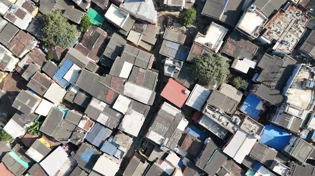 Mumbai, India - January 25, 2026: Top-down aerial view of densely built slum neighborhood. Concept of urban density, poverty, housing conditions and rapid city growth.