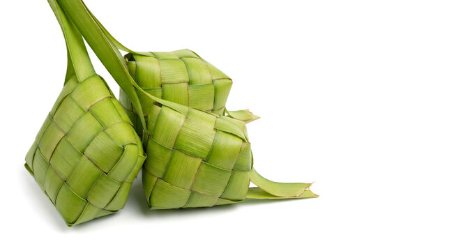 Ketupat or kupat, a typical Southeast Asian dish of rice wrapped in woven coconut leaves. Culinary icon during Eid or Eid al-Fitr. Isolated on white background