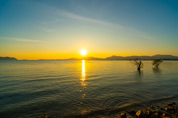Landscape view of majestic clouds in the sky sunset or sunrise over sea with reflection in the tropical sea,Beautiful cloudscape scenery,Amazing light of nature Landscape nature background