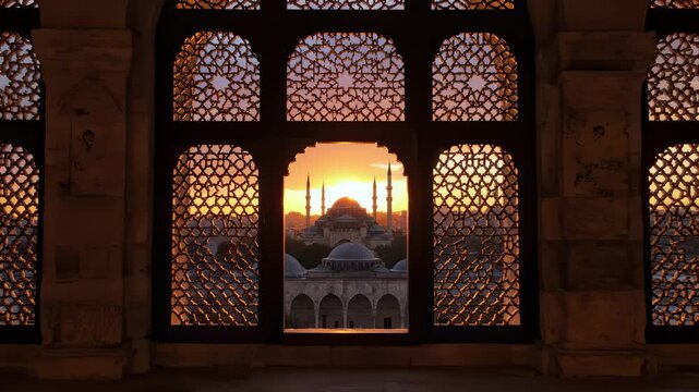 Silhouette Mosque and Cityscape Through Ornate Windows at Sunset