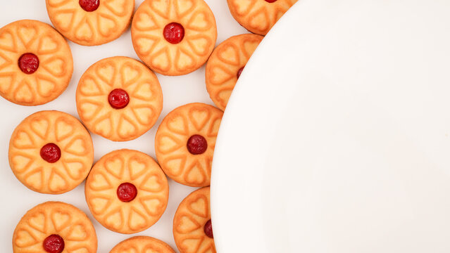 Strawberry jam biscuits on white background