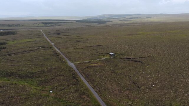Drone shot of a shieling by a remote road on the Outer Hebrides of Scotland.