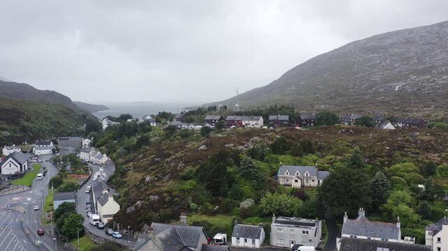 Drone shot of the ocean behind Tarbert town centre on the Isle of Harris.