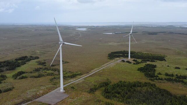 Drone shot of a wind farm. Stornoway on the Isle of Lewis is in the background.