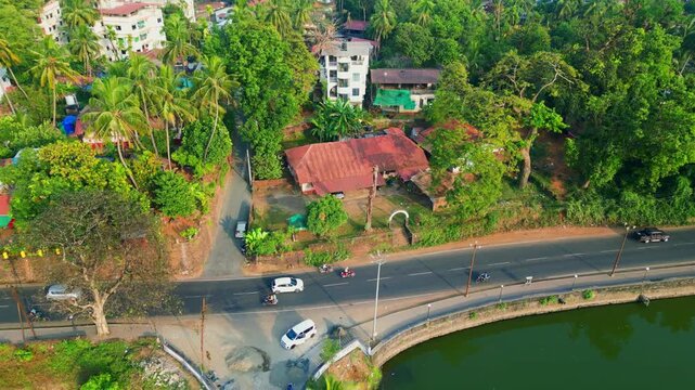 resident homes next to lake ariel view car passing