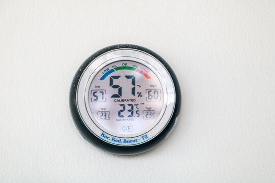 Digital Thermometer and Hygrometer Displaying Indoor Conditions