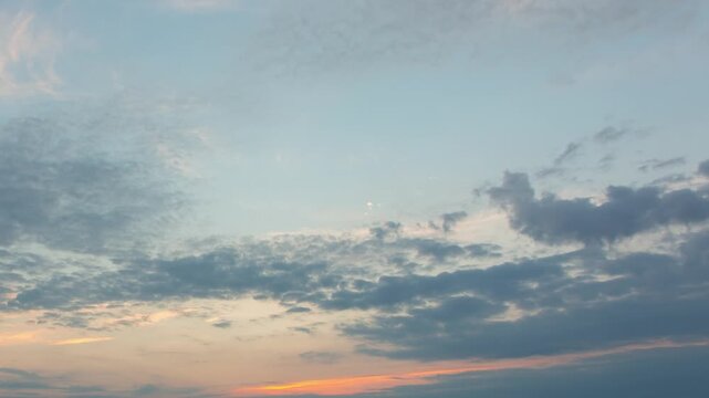 Clouds with orange sunrise on a beautiful sky in the morning, time-lapse video of early morning sunrise with beautiful sky