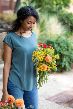 Woman holding fresh cut garden flowers