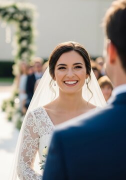 Smiling Bride in White Lace Dress at Outdoor Wedding Ceremony