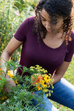 Woman holding fresh cut garden flowers