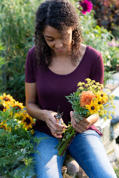 Woman holding fresh cut garden flowers
