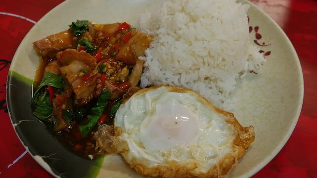 Thai Spicy Basil Stir-Fried Pork with Rice and Fried Egg Khao Pad Krapow