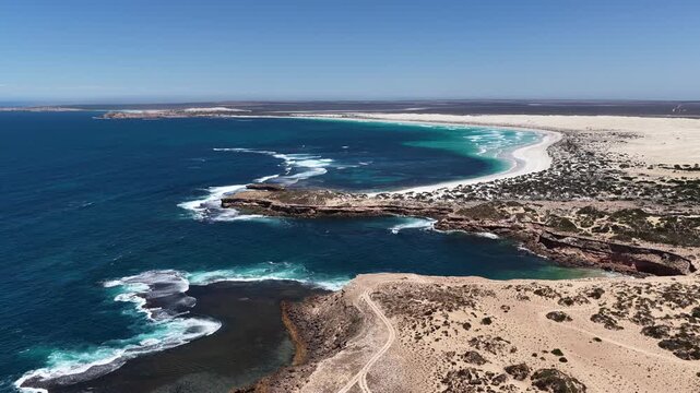 Scott Bay, Fowlers Bay, South Australia &ndash; 4K aerial drone view of Great Australian Bight coastline, turquoise ocean, sand dunes, white sand beach and limestone cliffs