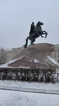 Saint Petersburg, Russia. Vertical video of famous monument to Peter the Great, the founder of Petersburg, by sculptor E. Falconet (1778), on Senate Square on snowy winter day