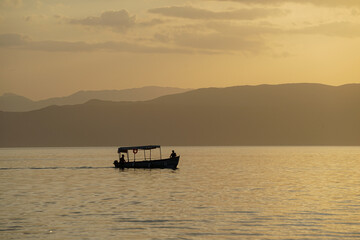 Obraz premium Where the Day Gently Ends – Dreamy Sunset Reflections at Lake Ohrid