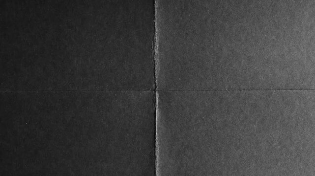 Black Paper Folded in Four Sections with Subtle Texture