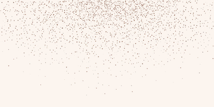 A scattering of delicate rose gold glitter particles on a soft background