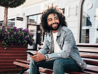 Handsome smiling hipster  model. Sexy unshaven Arabian man dressed in summer clothes. Fashion male...