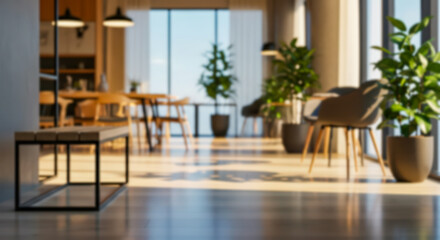 Fototapeta premium Blurred modern office waiting area or lounge with natural light, blurred interior view of contemporary furniture, potted plants, and large windows creating a bright, professional atmosphere