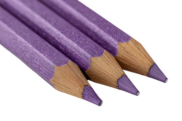 Close-up of three sharpened purple pencils