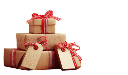 Fototapeta premium Stacked gift boxes, kraft paper wrapped, adorned with red and white ribbon bows and tags