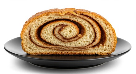 Fototapeta premium Closeup of a Golden Brown Cinnamon Roll on a Black Plate