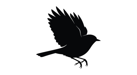 Obraz premium A black bird in flight with outstretched wings a striking silhouette