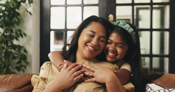 Love, kid or mother with hug on sofa for bonding together, healthy relationship or protection. Happy family, mom or girl with embrace in home for connection, support or affection with care on weekend