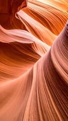 Obraz premium A winding canyon with smooth, layered, orange and brown rock formations