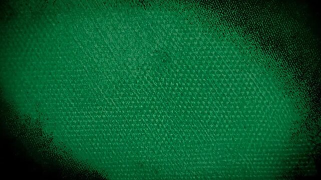Textured green background with a subtle diagonal pattern and dark vignette around edges