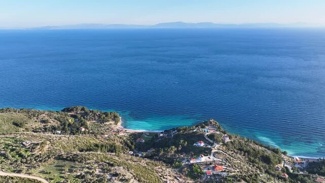 Flying over Samos island and the Aegean sea, Greece on a sunny day