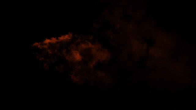 A single puff of orange ember smoke drifts slowly from left to right. Isolated on black background, ideal for compositing, explosion, or magic puff effects