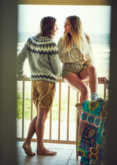 Naklejka premium Thinking, couple and relax on patio at beach with love, calm morning and reflection on holiday. Thoughts, people or terrace for fresh air, daydreaming and bonding together on ocean at vacation resort