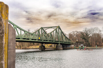 Glienicke Bridge (Bridge of Spies) over the Havel River with rowing crew, Germany
Glienicker Br&uuml;cke connecting Berlin and Potsdam under cloudy sky, Havel Rive