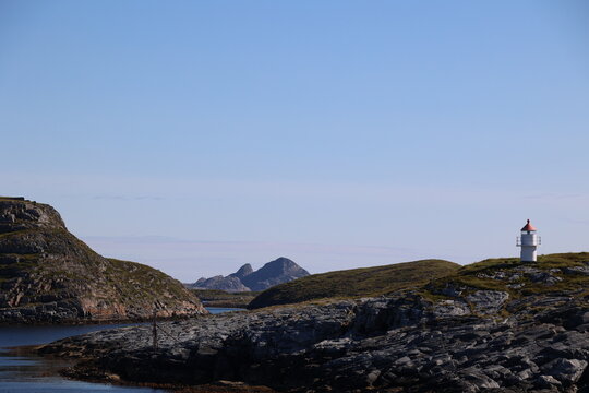 Marker buoy on a rock near the island of Traena, Norway  