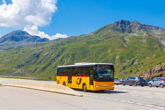 Typical swiss yellow post bus Postauto at the Simplon pass, Switzerland