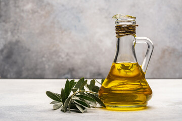 Organic olive oil  in jug  on  stone table